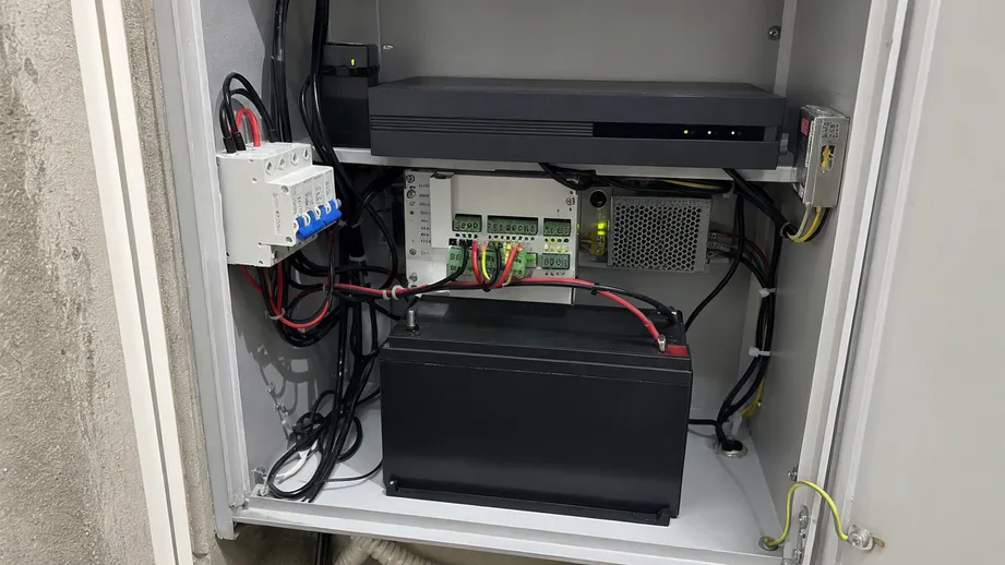 Compact 12V backup battery installed in a CCTV security system cabinet
