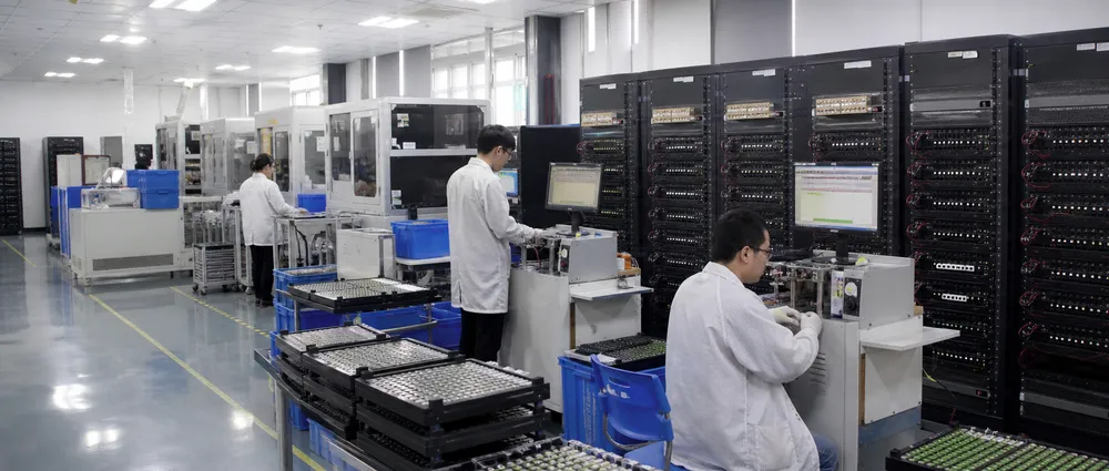 EVANBattery quality control laboratory with charge-discharge testing equipment and cell sorting machines