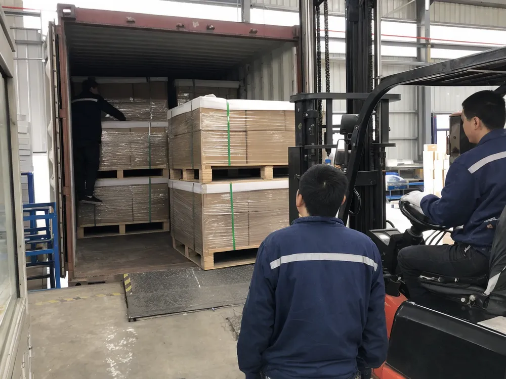 Gel solar battery pallets being loaded into shipping container with protective packaging