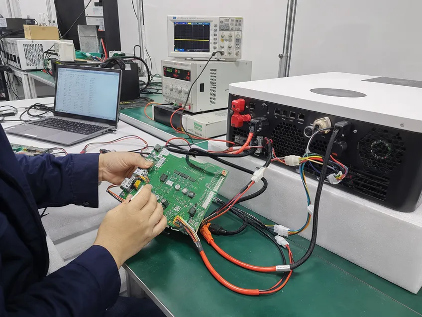 In-house BMS board paired with inverter during lab compatibility testing