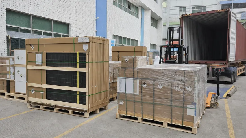 Mixed solar panel and battery storage shipment packaging on pallets ready for container loading