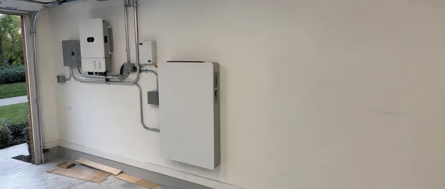 Wall-mounted home solar battery storage unit installed in residential setting