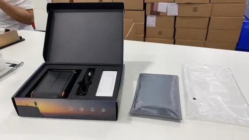 Retail and e-commerce packaging for portable solar battery charger with custom printed box and foam insert
