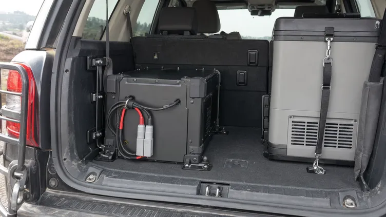 Rugged solar battery mounted in overlanding vehicle cargo area with Anderson connectors