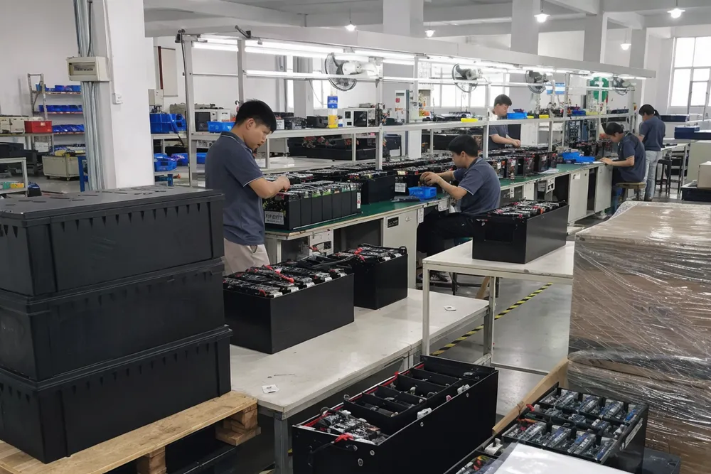 Solar battery bank production line at EVANBattery factory showing 12V, 24V, and 48V configurations